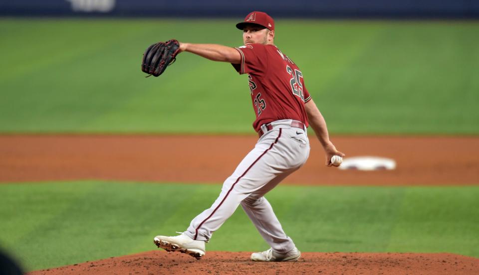 Arizona Diamondbacks' pitcher Corbin Martin (25) delivers during the second inning of a baseball game against the Miami Marlins, Wednesday, May 4, 2022, in Miami. (AP Photo/Jim Rassol)
