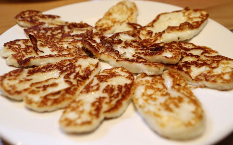 A plate of grilled halloumi  - Petros Karadjias /AP