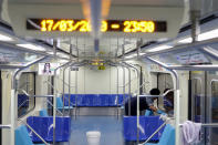 A cleaner works on the disinfection of a subway train as a measure against the coronavirus disease (COVID-19) in Sao Paulo