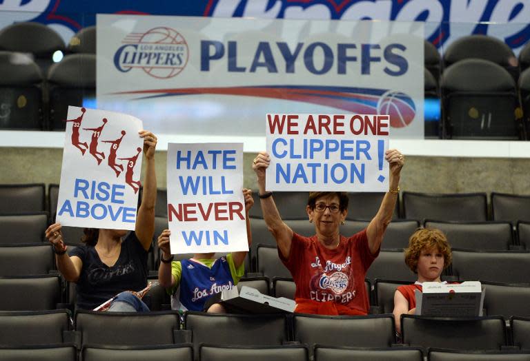 Fans display signs from their seats prior to Game 5 of the NBA playoff game between the Los Angeles Clippers and the Golden State Warriors on April 29, 2014 at Staples Center in Los Angeles, California