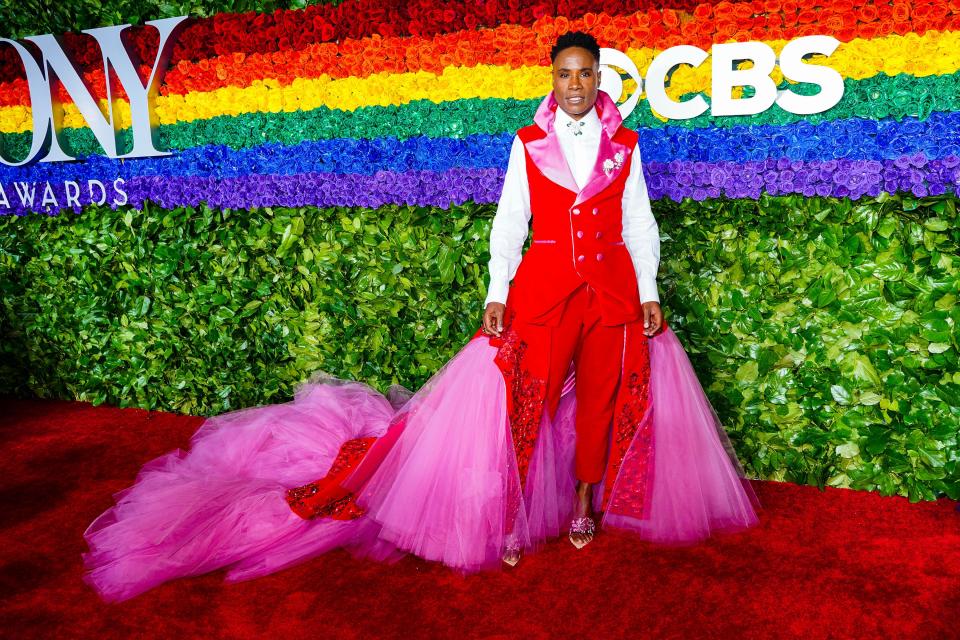 Billy Porter at the 2019 Tony Awards wearing pink and red outfit on red carpet