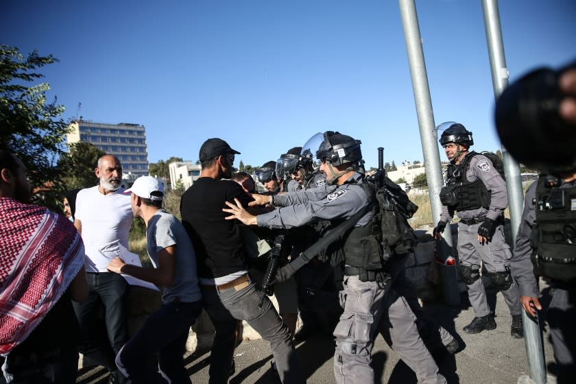 JERUSALEM - MAY 22: Israeli forces intervene in a demonstration by Palestinians on a call from Sheikh Jarrah locals in front of an Israeli forces' checkpoint in Sheikh Jarrah neighborhood of East Jerusalem on May 22, 2021. (Photo by Mostafa Alkharouf/Anadolu Agency via Getty Images)