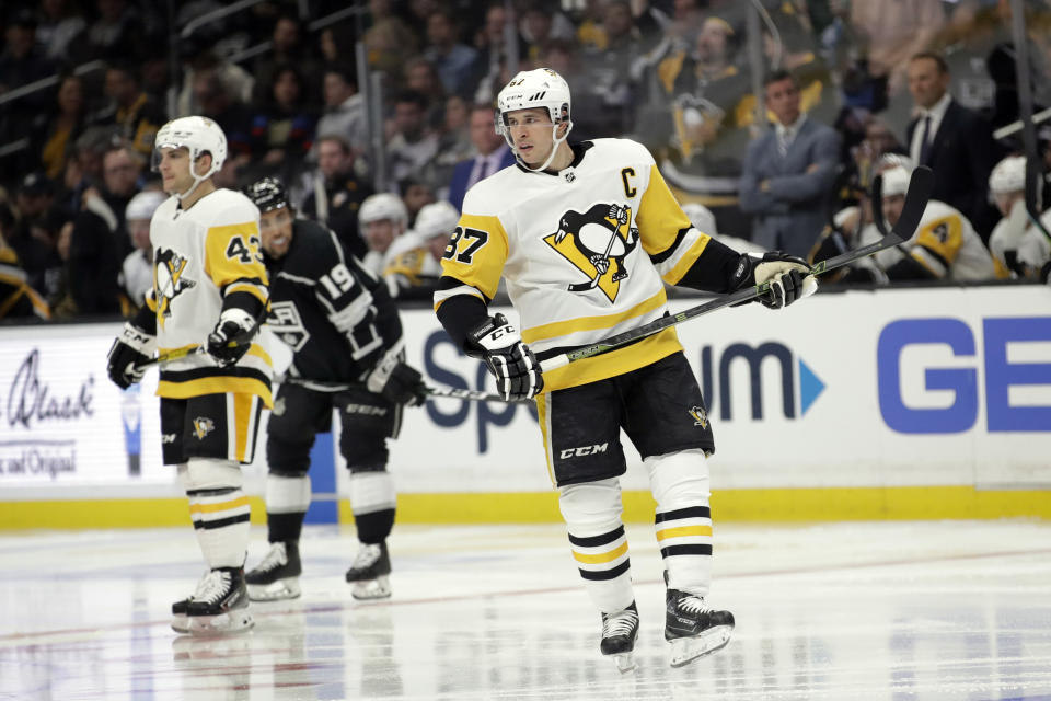 Pittsburgh Penguins' Sidney Crosby, right, skates during the second period of an NHL hockey game against the Los Angeles Kings Wednesday, Feb. 26, 2020, in Los Angeles. (AP Photo/Marcio Jose Sanchez)