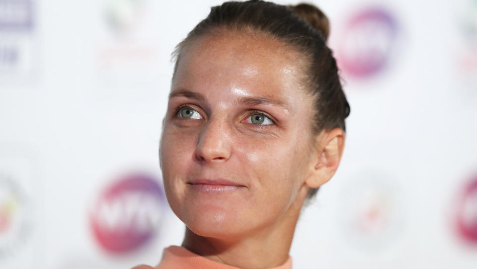 Karolina Pliskova smiles during a press conference.