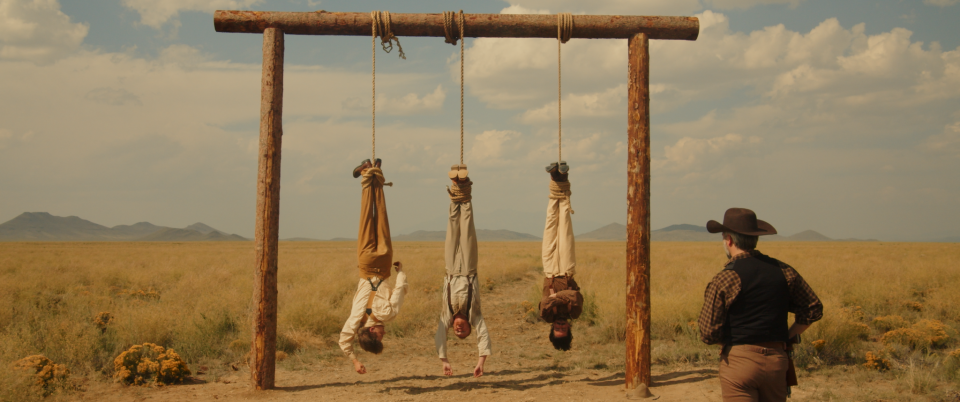 A still from "All Men Are Wicked" starring Michael Hansen, Raphael Sikic, Austin Cohen, and Ryon Thomas as the hangman.