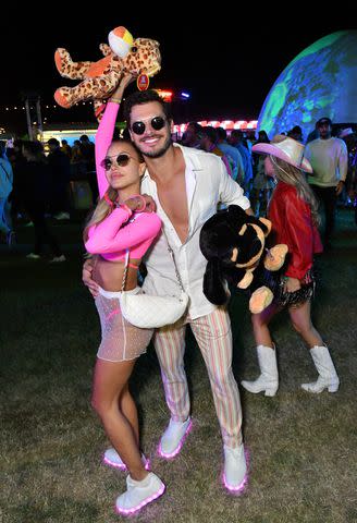 <p>Jerod Harris/Getty</p> Elena Belle and Gleb Savchenko at Levi's and Tequila Don Julio Present Neon Carnival with Hydration by Liquid I.V. on April 16, 2022