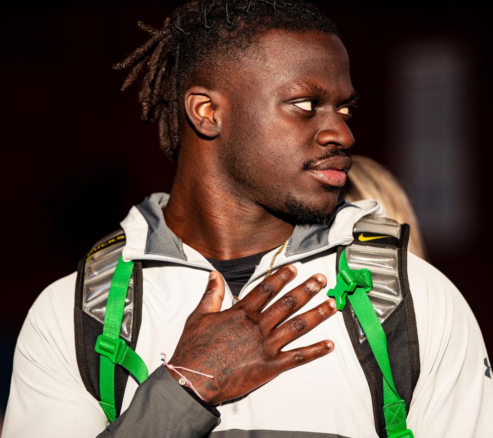 Richard Young, a top recruit football player for Lehigh Senior High School waits for a  helicopter carrying Georgia Bulldogs head football coach Kirby Smart  to land at Lehigh Senior High School on Thursday. Smart met with YoungÕs coaches.  