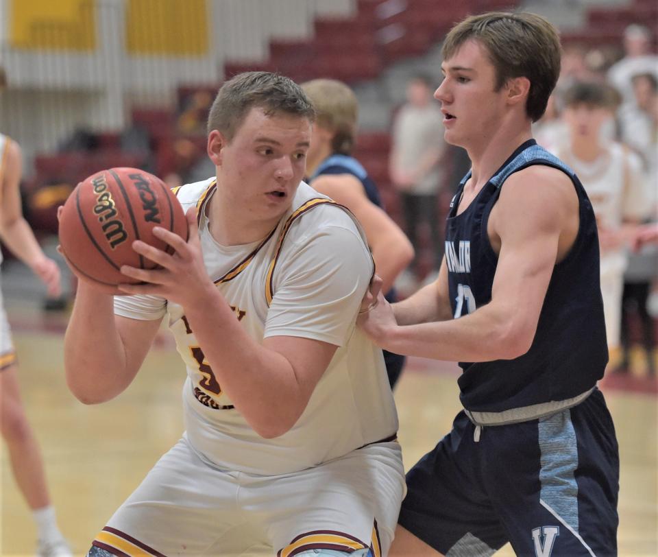 Rocky Mountain High School boys basketball player Ethan Thomason prepares to put up a shot during the Lobos' 96-72 win over visiting Valor Christian in a Class 5A playoff opener in February.