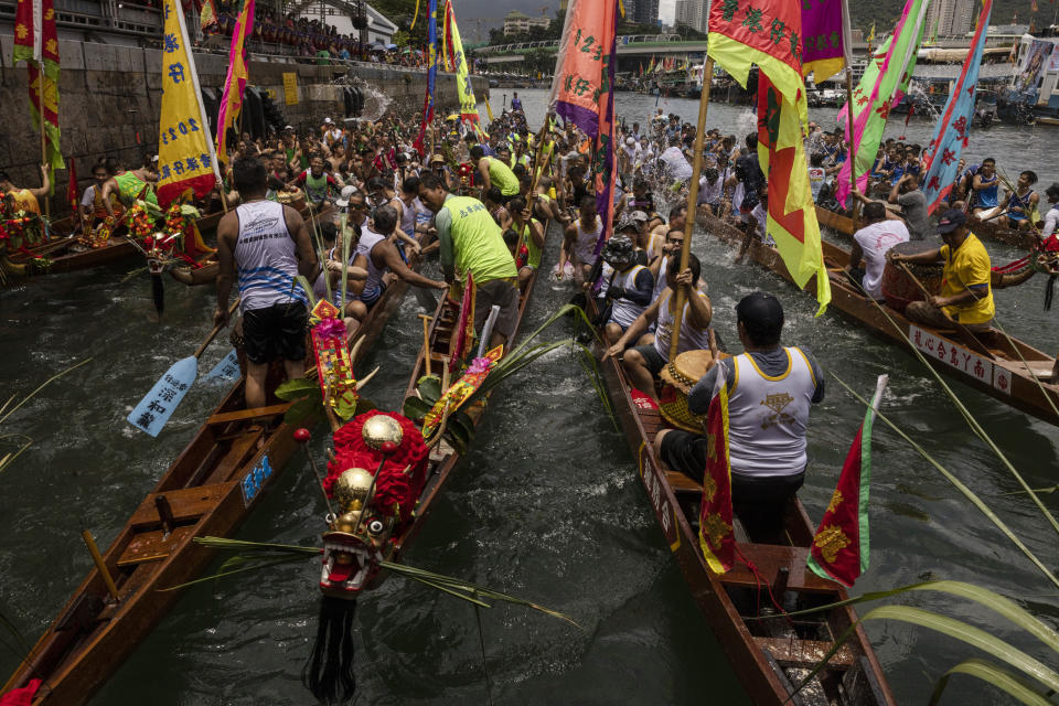 Competitors take part in the annual dragon boat race to celebrate the Tuen Ng festival in Hong Kong, Thursday, June 22, 2023. (AP Photo/Louise Delmotte)