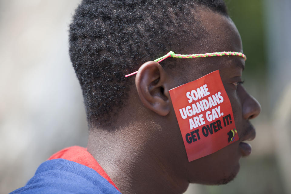 A Ugandan man is seen during the 3rd Annual Lesbian, Gay, Bisexual and Transgender (LGBT) Pride celebrations in Entebbe, Uganda, Saturday, Aug. 9, 2014.  Scores of Ugandan homosexuals and their supporters are holding a gay pride parade on a beach in the lakeside town of Entebbe. The parade is their first public event since a Ugandan court invalidated an anti-gay law that was widely condemned by some Western governments and rights watchdogs. (AP Photo/Rebecca Vassie)