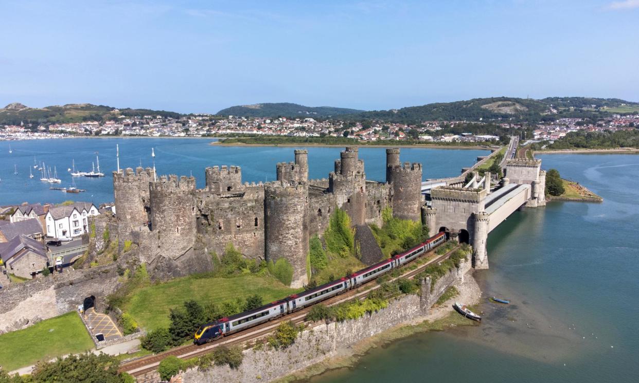 <span>The train from Dublin to London passes Conwy castle and its pretty waterfront.</span><span>Photograph: Paul Robertson/Avanti West Coast</span>