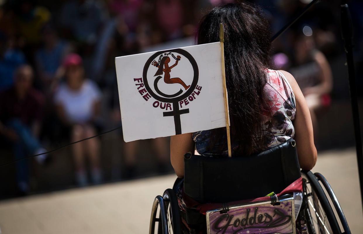 Disability rights activist Maria R. Palacios, shown at an Austin event in 2017, said people turn to protests after exhausting methods such as writing letters and knocking on doors. A Texas bill would prohibit textbooks from having "selections or works that condone civil disorder."