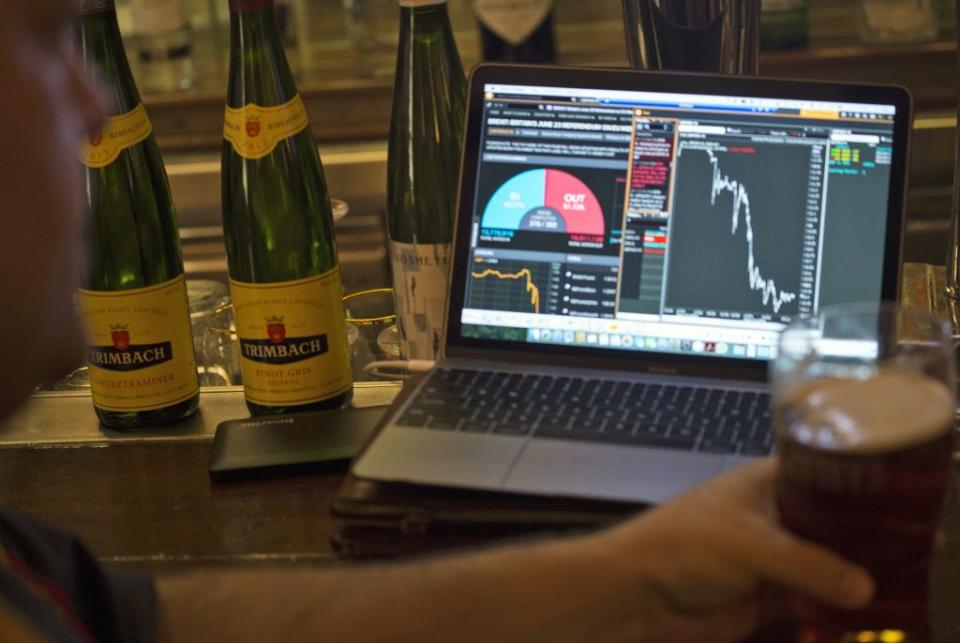 A British expat watches the British pound fall after the United Kingdom's EU Referendum results come in live on his laptop computer in Hong Kong, China, June 24. (EPA/Alex Hofford)