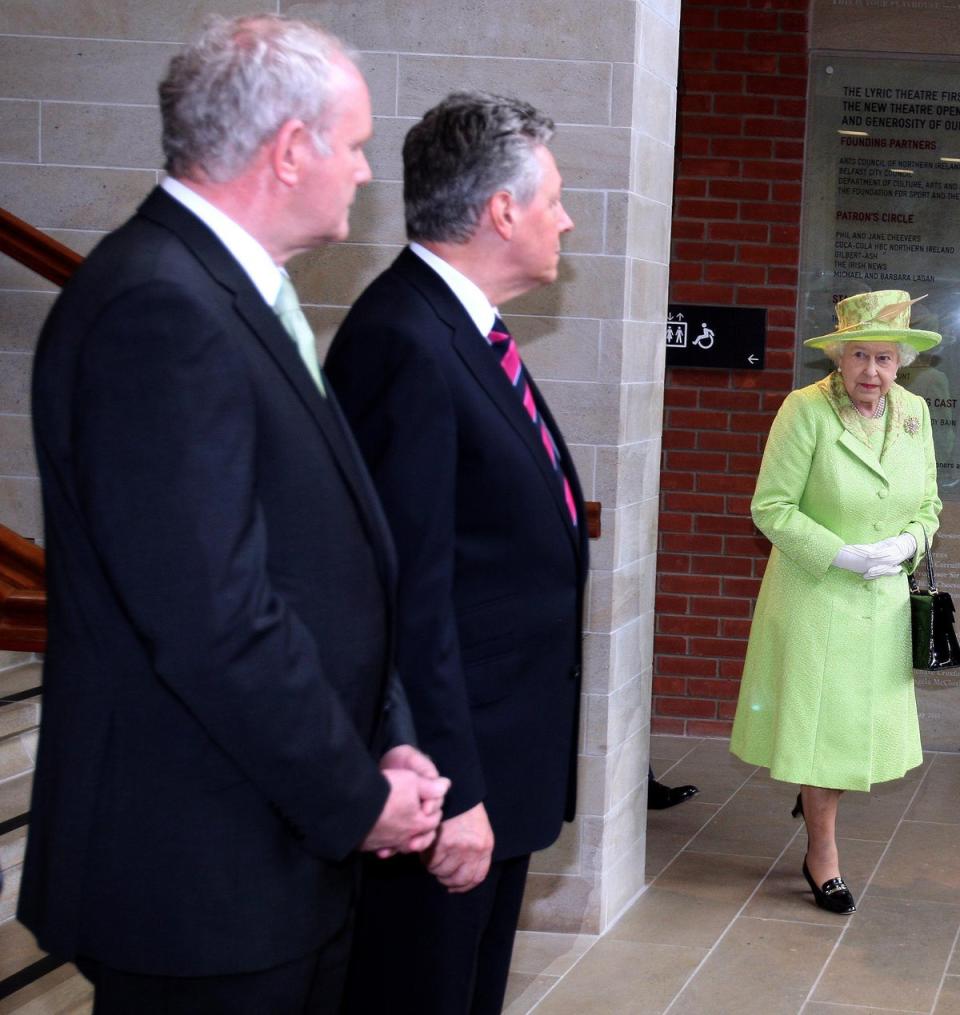 The Queen rounds a corner in the Lyric Theatre moments before she shook deputy First Minister Mr McGuinness’s hand (Paul Faith/PA) (PA Archive)