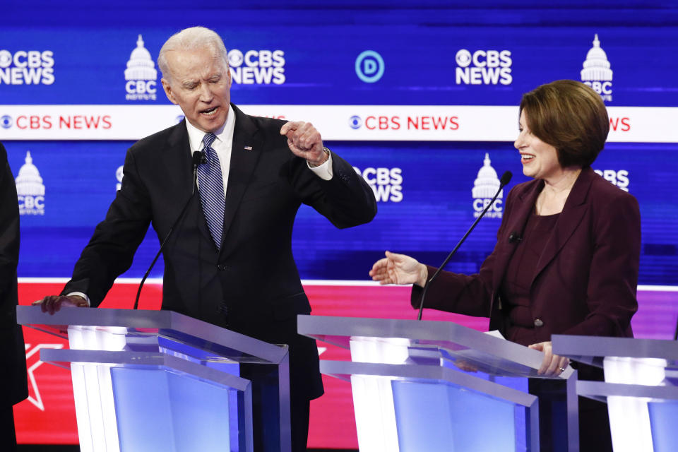 FILE - In this Feb. 25, 2020, file photo Democratic presidential candidates, former Vice President Joe Biden, left, and Sen. Amy Klobuchar, D-Minn., participate in a Democratic presidential primary debate at the Gaillard Center in Charleston, S.C., co-hosted by CBS News and the Congressional Black Caucus Institute. Klobuchar ended her Democratic presidential campaign on Monday, March 2, and endorsed rival Biden in an effort to unify moderate voters behind the former vice president's White House bid. (AP Photo/Patrick Semansky, File)