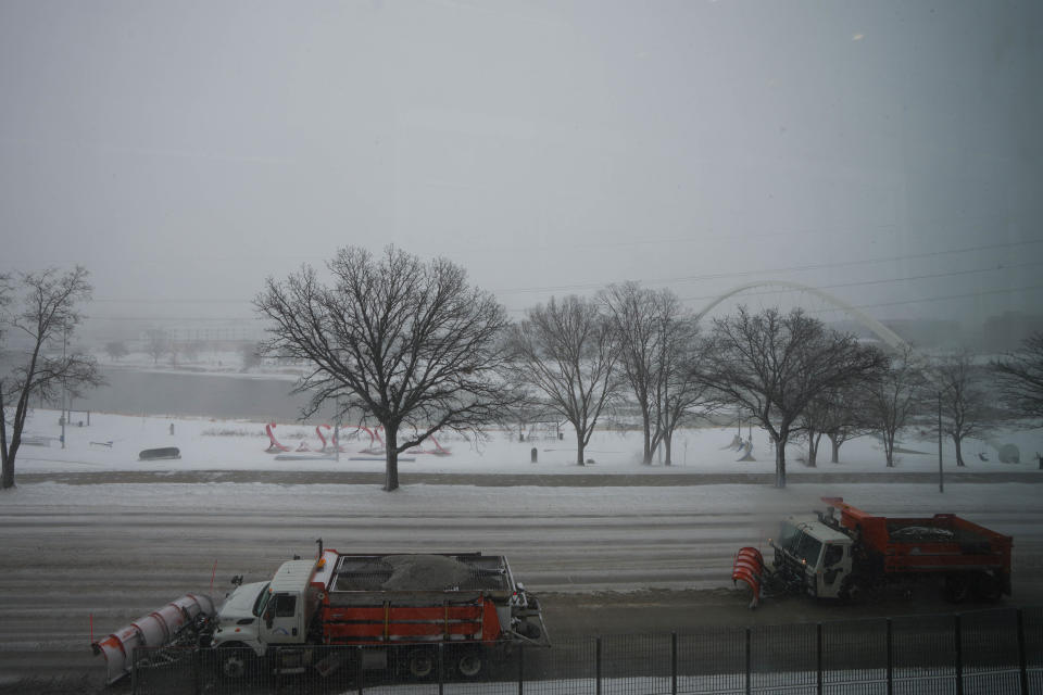 Snowplows plow Second Ave outside of Wells Fargo area on Thursday, Feb. 16, 2023.