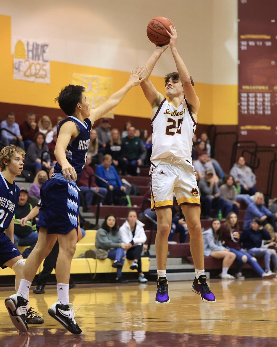 Southeast’s Aidan Fischer jumps up to hit a 3-pointer during Friday night’s home game against Rootstown High School.