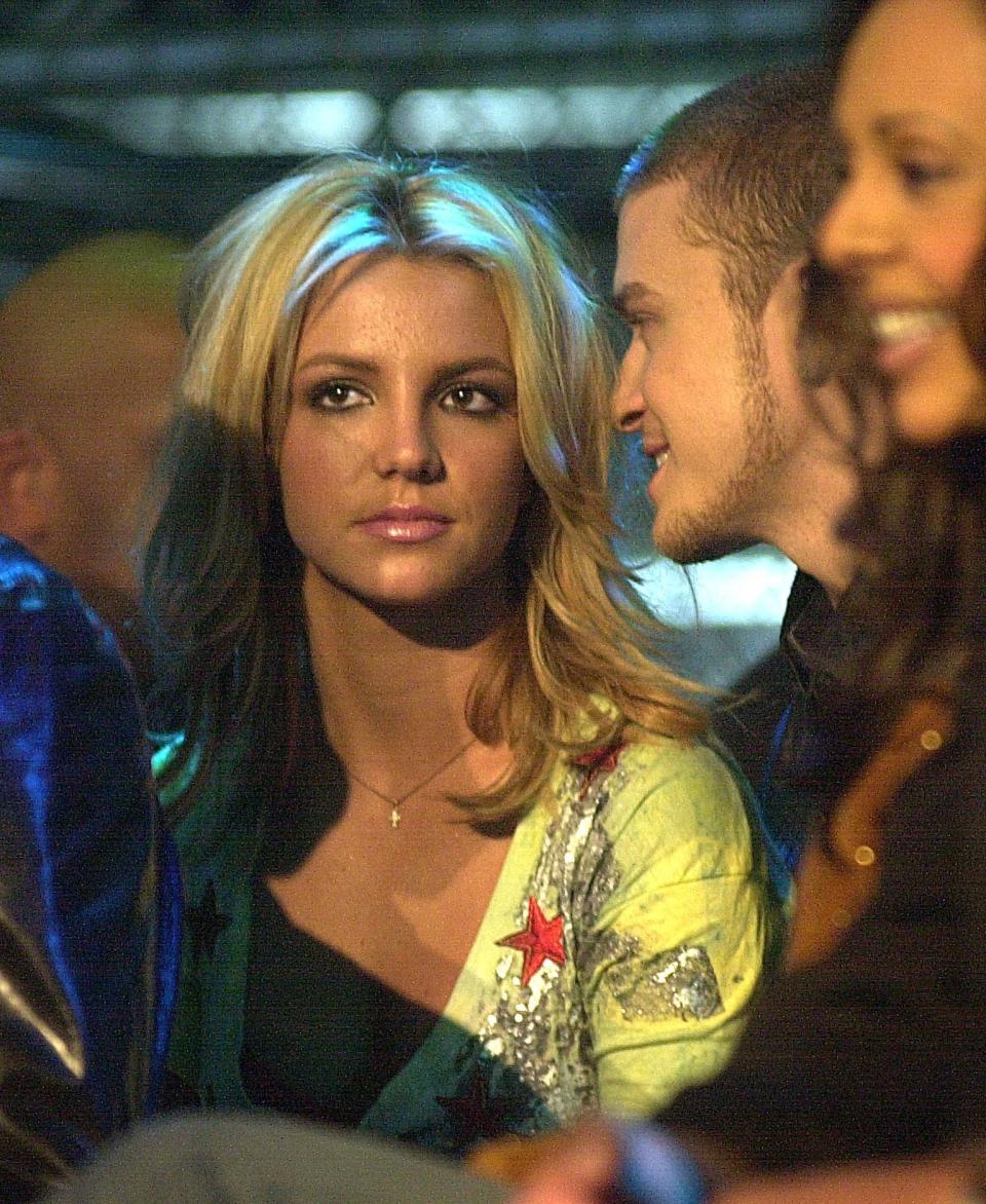 Close-up of Britney and Justin looking at her