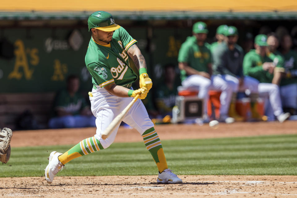 Oakland Athletics' Jordan Diaz hits a single against the Cincinnati Reds during the fourth inning of a baseball game in Oakland, Calif., Saturday, April 29, 2023. (AP Photo/John Hefti)