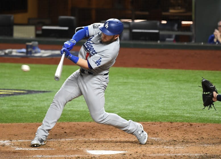 ARLINGTON, TEXAS OCTOBER 23, 2020-Dodgers Max Muncy hits two-run single against the Rays.