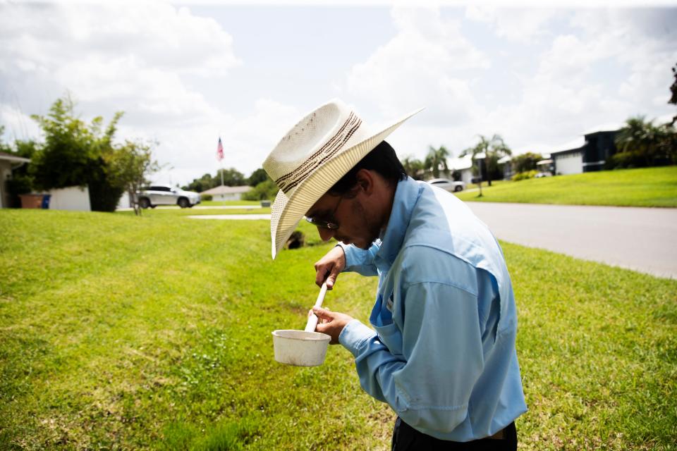 Johan Elrubaie, a field inspector for Lee County Mosquito Control checks swales in Buckingham for mosquito larvae on Tuesday, June 14, 2022. With recent rains and and standing water in some areas, the mosquito season is underway.  