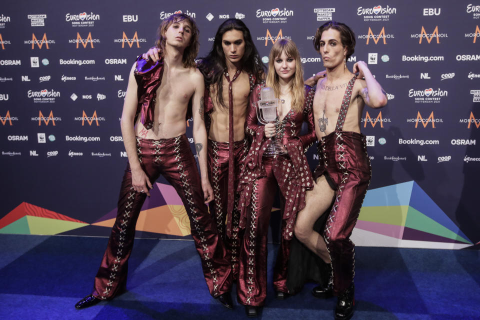 Members of the band Maneskin from Italy Thomas Raggi, from left, Ethan Torchio, Victoria De Angelis and Damiano David pose for photographers with the trophy after winning the Grand Final of the Eurovision Song Contest at Ahoy arena in Rotterdam, Netherlands, Saturday, May 22, 2021. (AP Photo/Peter Dejong)