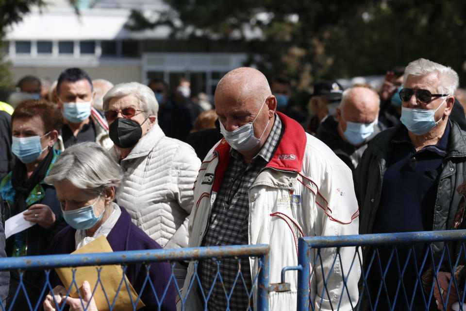 Residents wait to receive a dose of the AstraZeneca vaccine in Zagreb, Croatia, Thursday, April 8, 2021. Croatia has reported a surge in new coronavirus cases as the EU-member nation faces increasing public skepticism over the use of its main AstraZeneca shots. (AP Photo/Darko Bandic)