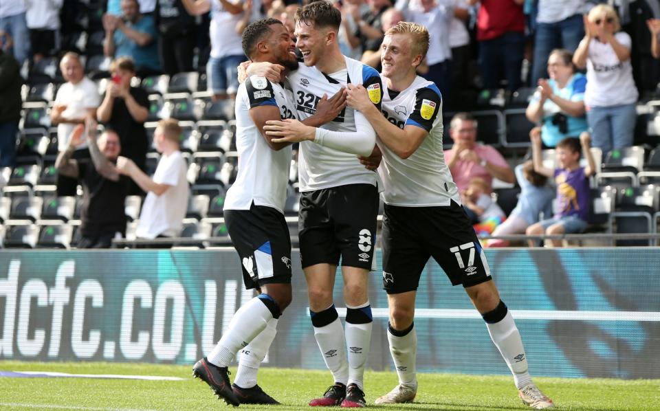 Derby County's Max Bird (centre) celebrates with Nathan Byrne (left) and Louie Sibley after scoring their side's first goal of their win over Stoke - PA