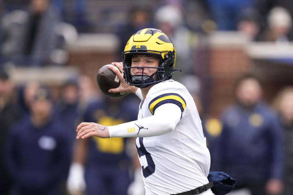 FILE - Michigan quarterback J.J. McCarthy plays during an NCAA college football intra-squad spring game, Saturday, April 1, 2023, in Ann Arbor, Mich. Michigan opens their season at home against East Carolina on Sept. 2. (AP Photo/Carlos Osorio, File)