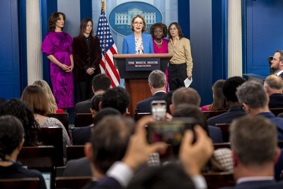 "The L Word" cast member Leisha Hailey, center, accompanied by fellow cast members Jennifer Beals, left, and Katherine Moennig, second from left, Television producer and "The L Word" co-creator Ilene Chaiken, right, and White House press secretary Karine Jean-Pierre, second from right, speaks during a press briefing at the White House in Washington, Tuesday, April 25, 2023, to mark Lesbian Visibility Week. (AP Photo/Andrew Harnik)