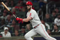 Philadelphia Phillies designated hitter Bryce Harper (3) hits a double during the second inning in Game 2 of baseball's National League Division Series between the Atlanta Braves and the Philadelphia Phillies, Wednesday, Oct. 12, 2022, in Atlanta. (AP Photo/John Bazemore)