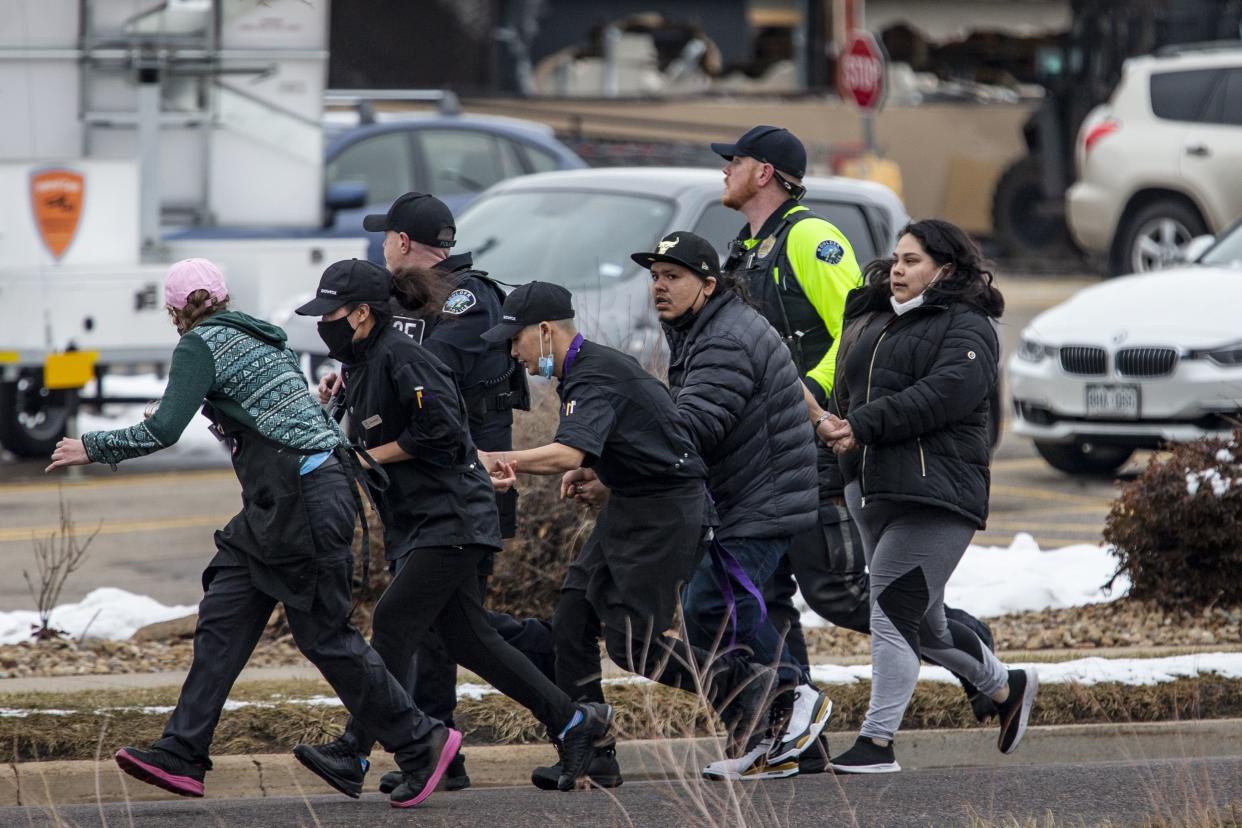 Shoppers are evacuated from a King Soopers grocery store after a gunman opened fire on March 22, 2021, in Boulder, Colorado. Dozens of police responded to the afternoon shooting in which at least one witness described three people who appeared to be wounded, according to published reports.