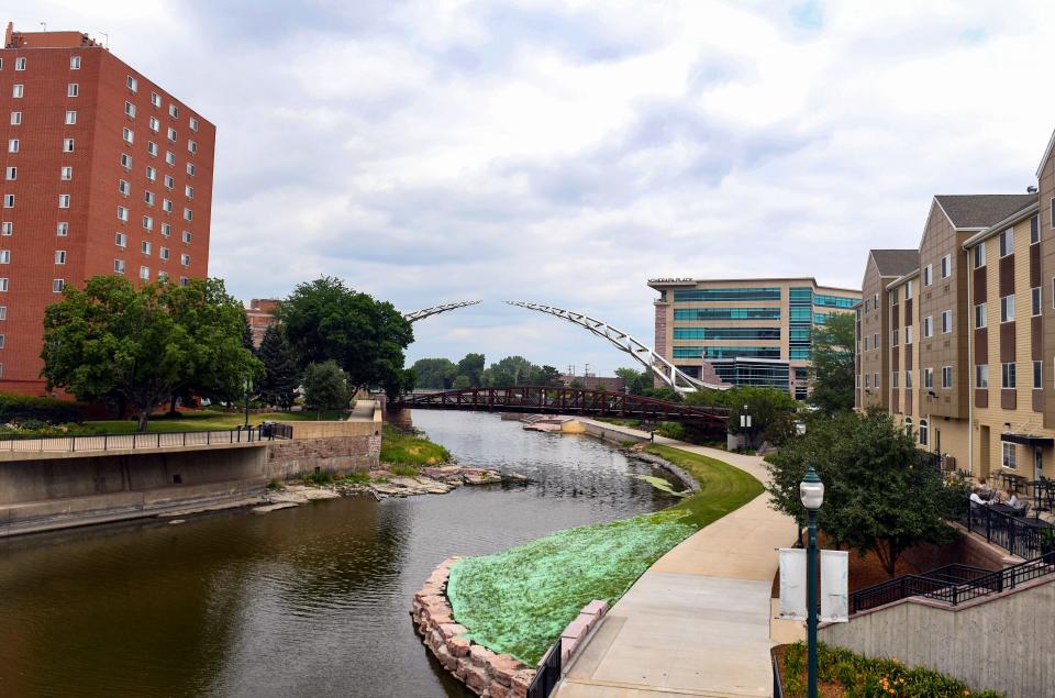 The Arc of Dreams sculpture is visible over the Big Sioux River on Wednesday, July 7, 2021, in downtown Sioux Falls.