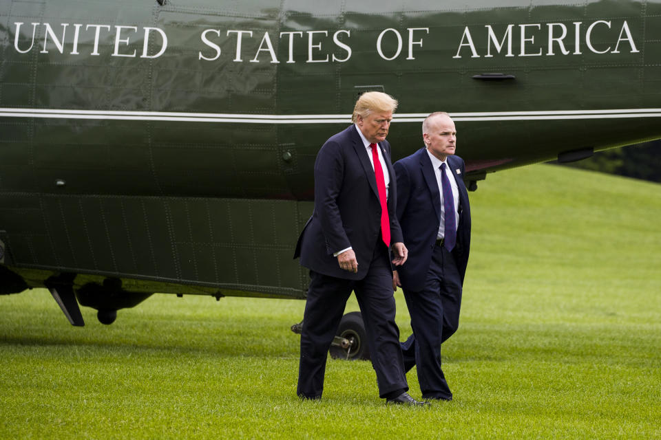 President Donald Trump walks with Secret Service special agent Robert Engel on the South Lawn of the White House on May 17, 2019. (Alex Brandon / AP)
