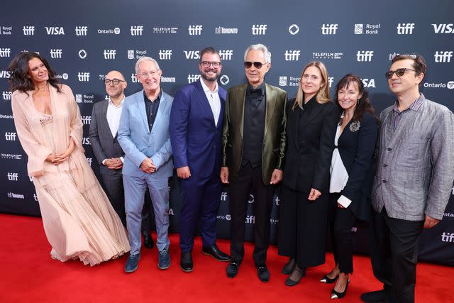 <p>Kayla Oaddams/WireImage</p> Andrea Bocelli and Cosima Spender (fourth and third from right) with crew and family at TIFF on Sept. 7, 2024