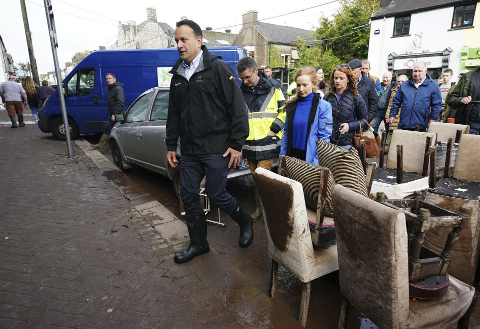 Taoiseach Leo Varadkar visits local businesses on Main Street following extensive damage as Storm Babet, the second named storm of the season swept in, in Midleton, Co Cork, Ireland, Thursday Oct. 19, 2023. Hundreds of people are being evacuated from their homes and schools have closed in parts of Scotland, as much of northern Europe braces for stormy weather, heavy rain and gale-force winds from the east. (Brian Lawless/PA via AP)