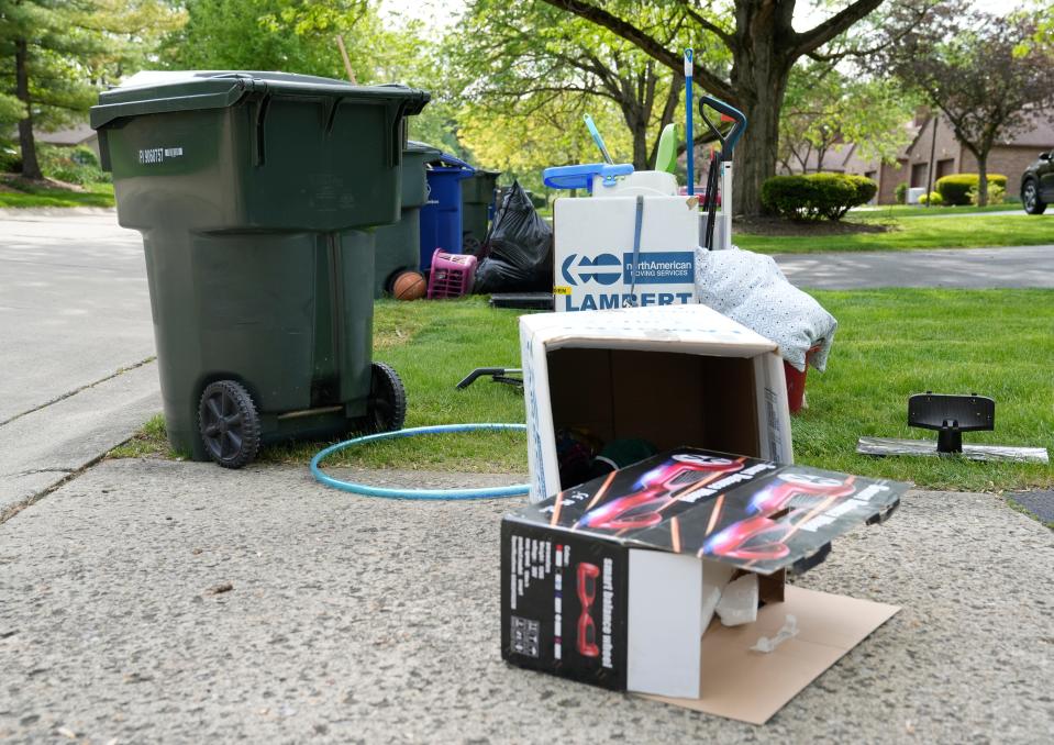 May 1, 2024; Columbus, Ohio, USA; 
Piles of discarded items including cleaning tools and materials are seen along rented townhomes on Griggsview Court near Hilliard. Residents claim that Peak Property Group, who recently purchased the rentals, are forcing them to leave to update the units and rent them for higher prices.
