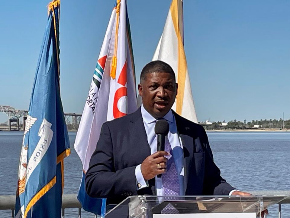 Louisiana Transportation Secretary Shawn Wilson, pictured here on Feb. 9, 2023, in Lake Charles during a press conference announcing a $150 million grant to replace the Calcasieu River Bridge in the background, announced his retirement Feb. 15, 2023. Wilson, a Democrat, is expected to launch a bid for governor.