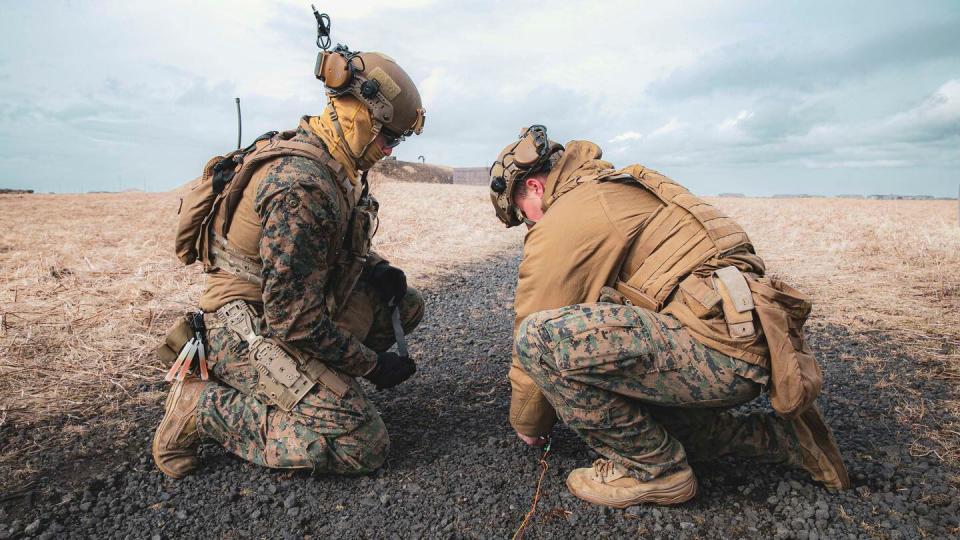 Marine Corps Explosive Ordnance Disposal Technicians, assigned to the 22nd Marine Expeditionary Unit, build an explosive charge during an EOD exercise in support of exercise Northern Viking 2022, on Keflavík Air Base, Iceland, April 10, 2022. (Mass Communication Specialist 1st Class Tyler Thompson/Navy)
