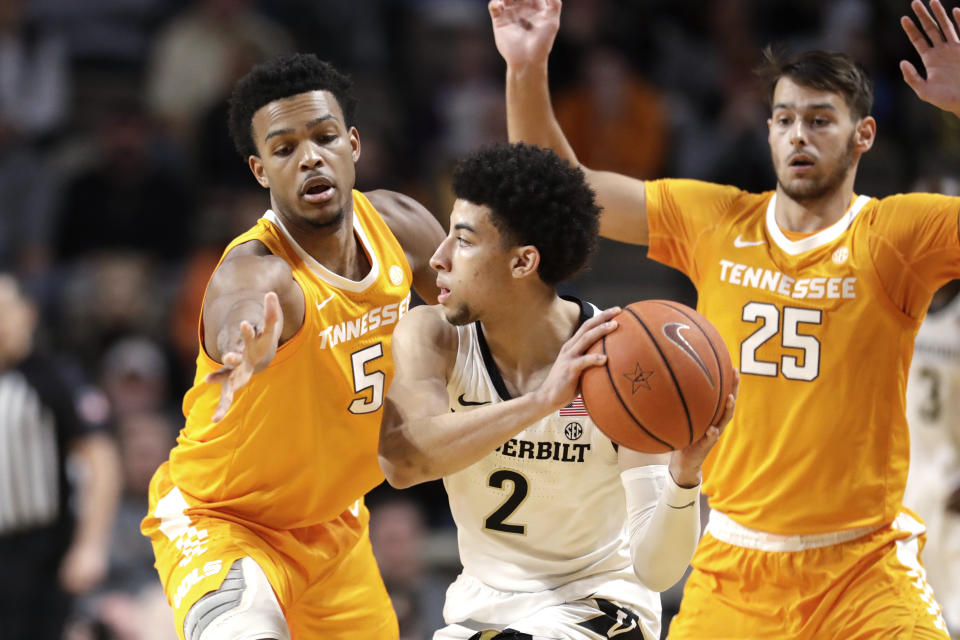 Vanderbilt guard Scotty Pippen Jr. (2) is guarded by Tennessee's Josiah-Jordan James (5) and Santiago Vescovi (25) during the first half of an NCAA college basketball game Saturday, Jan. 18, 2020, in Nashville, Tenn. (AP Photo/Mark Humphrey)