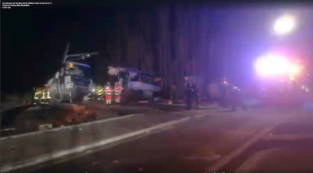 Rescue workers are seen on the site of collision between train and school bus in Millas, France December 14, 2017 in this handout still image from a video. Must Credit France Bleu Roussillon/Handout via REUTERS