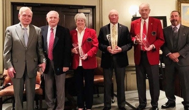 Two past Players Championship chairman, Anne Nimnicht (second from the left) and John Tucker (second from the right) have received the Deane Beman Award for service to First Coast golf.