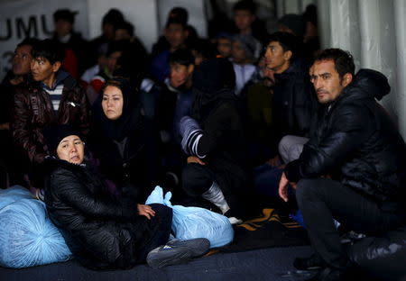 Refugees and migrants board Turkish Coast Guard Search and Rescue ship Umut-703 after a failed attempt of crossing to the Greek island of Lesbos off the shores of Canakkale, Turkey, November 8, 2015. REUTERS/Umit Bektas