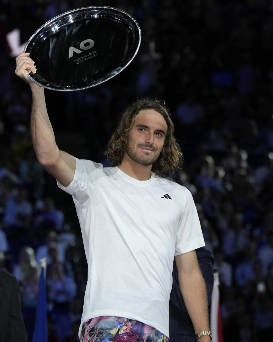 Stefanos Tsitsipas of Greece gestures after receiving his trophy for runner-up to Novak Djokovic of Serbia in the men's singles final at the Australian Open tennis championship in Melbourne, Australia, Sunday, Jan. 29, 2023. (AP Photo/Aaron Favila)