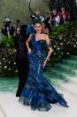 For her first look of the night, Zendaya stunned in a Maison Margiela Artisanal by John Galliano gown, complete with thoughtful little garden details. According to Margiela, Zendaya's dress “was inspired by the 1930s mythological works of the photographer Madame Yevonde and imbued with the memory of the orgiastic sceneries of the bacchanals of Ancient Greece.”