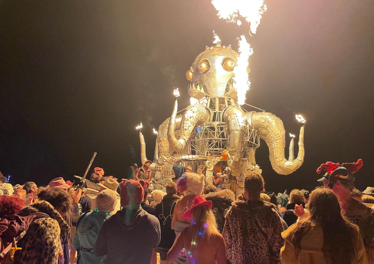 Attendees dance during the annual Burning Man Festival in the early morning of September 5, 2023 (AFP via Getty Images)