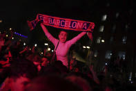 Barcelona fans celebrate in the street after their team won the Spanish La Liga championship by beating crosstown rivals Espanyol in Barcelona, Spain, Sunday May 14, 2023. (AP Photo/Joan Mateu Parra)