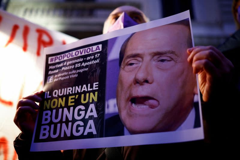 FILE PHOTO: Anti-Berlusconi protesters hold demonstration against former PM's bid for Italian presidency in Rome