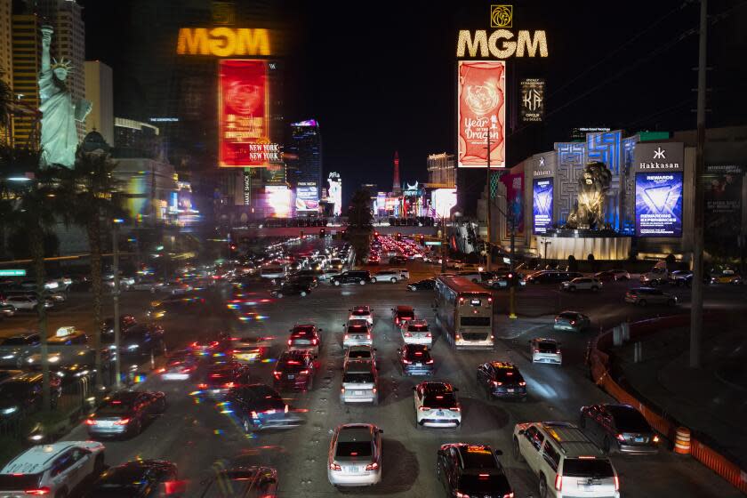 A Lunar New Year ad is displayed on an MGM Resorts billboard as traffic moves through the Las Vegas Strip ahead of Super Bowl 58, Saturday, Feb. 10, 2024, in Las Vegas. The Kansas City Chiefs will play the NFL football game against the San Francisco 49ers on Sunday. (AP Photo/Andy Bao)