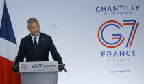 French Finance Minister Bruno Le Maire delivers his speech at the end of the G-7 Finance Thursday, July 18, 2019 in Chantilly, north of Paris. Finance ministers from the Group of Seven rich democracies are sounding the alarm on the dangers of cryptocurrencies and pouring cold water on Facebook's Libra as they wrap up a two-day meeting in Chantilly, France. (AP Photo/Michel Euler)